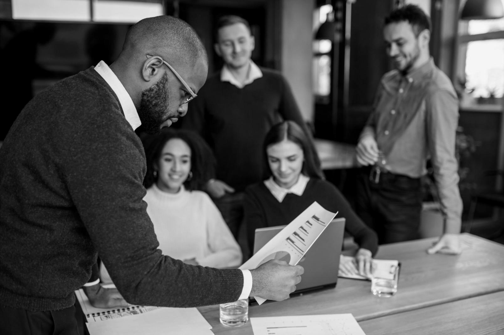 Adelaide family reviewing budget spreadsheets at kitchen table