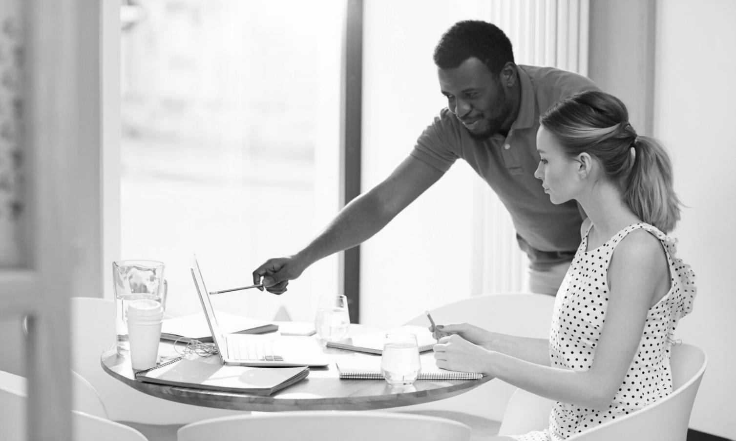 Student working through financial exercises with various learning materials